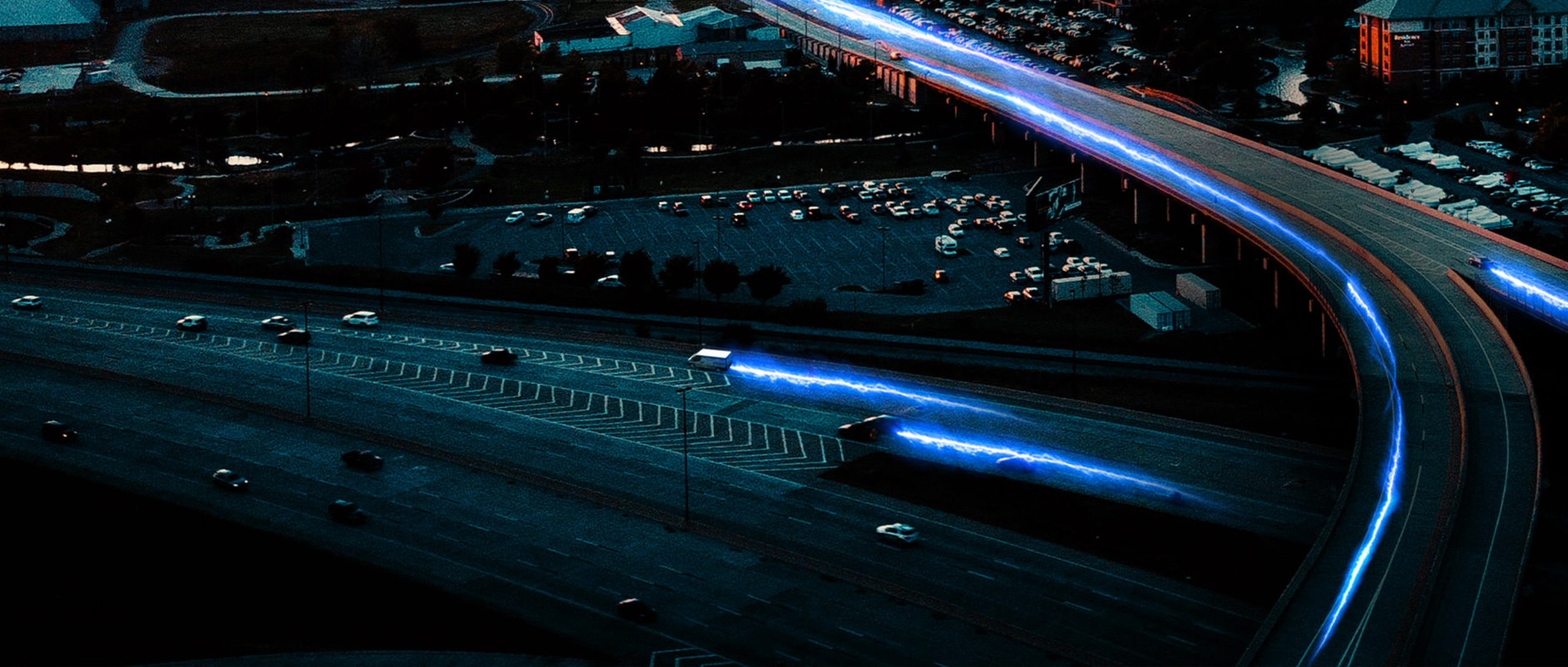 Night cityscape of vehicles on highway